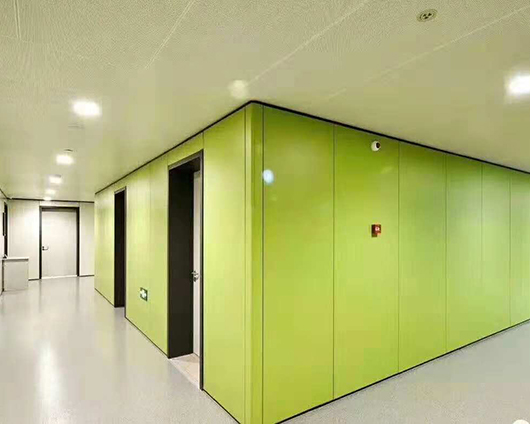 Custom-made all-steel partition wall with hanging plates.